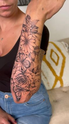 a woman with a tattoo on her arm