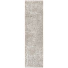 a long white rug with an abstract design on the bottom, and a gray background