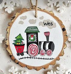 a wooden ornament with a train on it