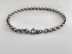 "Compact cable medium-weight chain minimalist sterling silver bracelet, unisex Choose your length: 5 ½, 6, 6 ½, 7, 7 ½, 8, 8 ½, 9, 9 ½, 10 inches. Unisex, for men or women Smaller link 4.3mm round cable chain but heavy gauge wire and compactly made, so it's a medium weight bracelet, still very comfortable to wear, with high-quality medium teardrop swivel clasp. Sterling silver has been medium oxidized, with subtle brushed finish and lightly polished, so has just a tad of rustic vintage feel. You Sterling Silver Rolo Chain Bracelet For Everyday, Minimalist Adjustable Sterling Silver Bracelet With Solid Link, Silver Rolo Chain Bracelet For Everyday, Minimalist Link Bracelet With Sterling Silver Clasp, Minimalist Link Bracelets With Sterling Silver Clasp, Everyday Silver Bracelet With Rolo Chain, Everyday Sterling Silver Bracelet With Solid Link, Classic Sterling Silver Cable Chain Bracelets, Classic Sterling Silver Bracelet With Lobster Clasp For Everyday