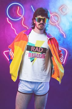 a man wearing sunglasses and a shirt with the word rad dad printed on it