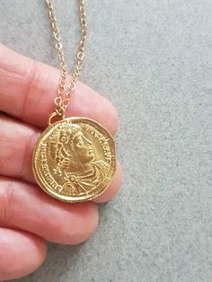 Gold coin necklace, coin necklace, gold coin pendant, antique necklace, delicate gold necklace, antique coin necklace, gold pendant necklace Delicate gold pendant necklace with an antique coin pendant, great for everyday wear, unique and beautiful. The necklace is made of 14k gold filled The pendant is an original antique Greek gold coin, which I duplicated and later casted and plated with 14k gold. The gold coin necklace is also available in sterling silver. Dimensions: The pendant's diameter i Antique Gold Coin Pendant Medallion Necklace, Antique Gold Medallion Necklace With Coin Pendant For Gift, Antique Gold Coin Necklace In Brass, Antique Gold Brass Medallion Necklace With Coin Pendant, Vintage Charm Necklace With Coin Pendant Medallion, Vintage Charm Necklace With Coin Medallion Pendant, Vintage Charm Necklace With Coin Pendant, Vintage Charm Necklace With Coin Medallion, Gold Chain Necklace With Coin Pendant