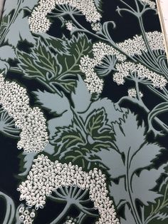 an image of a wallpaper pattern with flowers on black and green colors, in the style of art nouveauism