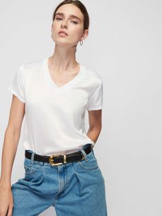 The V neck version of your favorite luxe Hammered Satin tee with a laid-back ribbed neckband. Sexy, effortless, and already a classic. (This one comes in White.) | Women's June Short Sleeve Top in White | Ethical Essentials Nation Ltd, Tap Water, Distilled Water, Wrinkle Remover, New Tops, V Neck Tee, V Neck Tops, World Of Fashion, Short Tops