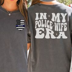 Cop Wife Comfort Colors Shirt is the perfect gift for a Police wife or wife to be!  In the personalization box, enter the number or last name for the front pocket of the shirt. (Ex: 589 or Smith) This shirt runs true to size.  If you want an oversized look, please order one size up.  If you want the oversized dress look, please size up two sizes. Short Sleeve: This is made with a 1717 Comfort Colors, garment-dyed t-shirt. Made with 100% ring-spun cotton, soft-washed, and garment-dyed fabric brin Cop Wife Shirt, Cop Wife, Police Wife Shirt, Leo Wife, Wife To Be, Police Wife, Comfort Colors Shirt, Oversized Dress, Wife Gift