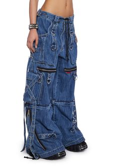 cuz make a statement. These jeans have a washed denim construction, front and back pockets, D-ring hardware, cargo pockets with velcro closures, strappy detailing, decorative zippers, adjustable zipper closures on the pant legs to transform into shorts, adjustable drawstrings, and a front zipper and button closure. Denim Tripp Pants, Tripp Nyc Jeans, Nyc Tripp Pants, Blue Goth Outfits, Jeans With Straps, Unbuttoned Jeans, Patchy Jeans, Tripp Jeans, Raver Jeans