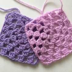 two crocheted squares are sitting next to each other