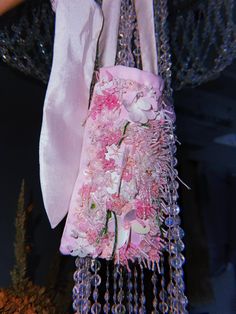 A small handbag sewn from delicate pink satin. This bag has two long textile handles from taffeta that can be tied to create the length you need. Flowers made of Japanese and Czech beads and bugle and Italian sequins are embroidered. Size: Length - 19 cm Height - 10 cm Width - 5.5 cm The length of the handle is 49 cm with carabines Beaded Tote Bag, Bag Embroidery, Textile Bag, Bridal Bag, Satin Bags, Beaded Bag, Flower Bag, Small Handbag, Embroidered Bag