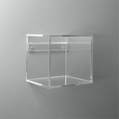 an empty glass box hanging on the wall