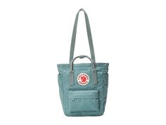 Fjallraven Kanken Totepack Mini - Tote Handbags : Frost Green : The Fjällräven Kånken Totepack Mini is a smaller commute option to take anywhere, transforming from a tote, to a backpack with ease when changing commute options or walking around the local grocer. Waterproof G-1000 HeavyDuty Eco S fabrication keeps your stuff dry all-day long. Main compartment can hold all your daily essentials. Interior lined with a padded base for tablets. Zippered top main compartment opening. Front zippered com Casual Backpack With Top Carry Handle, Casual Daily Use Backpack With Top Carry Handle, Casual Outdoor Bags With Adjustable Straps, Casual Waterproof Backpack For Daily Use, Casual Waterproof Backpack, Casual Waterproof Backpack For Everyday Use, Kanken Totepack Mini, Fjallraven Kanken Totepack, Kanken Totepack