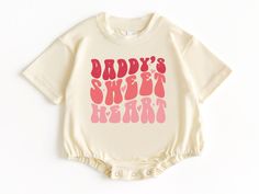 Daddy's Sweet Heart T Shirt Bubble Romper, Valentines Baby Outfit, Valentines Day Shirt, Baby Valentines Outfit, Baby Bodysuit, Baby Clothes 💗  Welcome to The WildflowerbyMiley Etsy Shop!  This listing is for the bodysuit, sweatshirt or t-shirt only. All other items that are shown in our photos such as shoes, hats, beanies, blankets etc. are for photo staging purposes and are NOT INCLUDED in the sale. DESCRIPTION:  This baby and children's unisex essential fits like a well-loved favorite. Super soft t-shirts, sweatshirts and baby bodysuits for your little lads and gals meant to showcase their big personalities. Its Excellent quality and vibrant print makes one fall in love with it over and over again.  This adorable piece is the perfect lightweight layer for casual wearing.  This product Graphic Print Onesie For First Birthday, Cute Short Sleeve Onesie For Mother's Day, Cute Mother's Day Onesie With Short Sleeves, Mother's Day Cute Short Sleeve Onesie, Family Matching Short Sleeve Onesie For Mother's Day, Valentines Baby Outfit, Baby Valentines Outfit, Baby Valentines, Valentines Baby