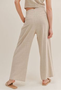 Our Forever Muse Pinstripe Pants has a wide leg fit and a front zip closure. The lightweight feel of the fabric allows you to move comfortably while looking put together. Front Zipper Closure Inverted Front Pleats 70% RAYON 30% LINEN Model is wearing a size small. LE1703 Spring Striped High-waisted Wide Leg Pants, Spring Wide Leg Pants With Vertical Stripes, Casual Wide Leg Pants With Striped Hem, Spring Wide-leg Pants With Vertical Stripes, Straight Pants With Contrast Stripes For Spring, Casual Wide Leg Bottoms With Vertical Stripes, Spring Striped Wide-leg Pants, Wide Leg Bottoms With Striped Hem For Summer, Spring Striped Wide Leg Pants