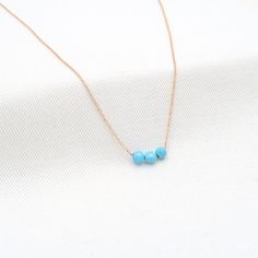 "3 Turquoise Necklace Dainty Choker. Yellow Gold Filled 14K | Turquoise choker simple gemstone | 4 mm round and plate Turquoise Necklace | ------------------👑DESCRIPTION------------------  Type : Necklace   Made of : Yellow gold filled  Very Tiny Chain (1mm) This is So delicate and feminine it is perfect for Layered Jewelry  Precious Stone : High Quality Blue Turquoise  Length Min : 18  Length Max: 18 (choose yours)  Handmade in Paris Note that it is a delicate and very cute Jewelry the Width o Everyday 14k Gold Turquoise Jewelry, Everyday Turquoise 14k Gold Jewelry, Dainty Turquoise Jewelry With Delicate Chain, Yellow Gold Turquoise Necklace With Round Beads As Gift, Minimalist Yellow Gold Jewelry With Gemstone Beads, Dainty Turquoise Gemstone Jewelry, Adjustable Turquoise Birthstone Necklace, Dainty Turquoise Gemstone Beads Necklace As Gift, Dainty Turquoise Gemstone Bead Necklace For Gift