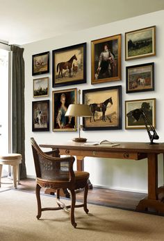 a home office with pictures on the wall