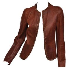 TOM FORD for YVES SAINT LAURENT Safari Jacket S/S 2002 100% Leather has distressed finish and embellished with rings. FR size 38 - US 6 shoulders 16", sleeve 25.5", total length 23" Unlined In excellent condition Ysl Ring, Tom Ford Jacket, Embellished Blazer, Tulle Jacket, Evening Suit, Leather Blazer Jacket, Embellished Jacket, Brown Blazer, Safari Jacket