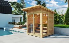 a wooden sauna next to a swimming pool