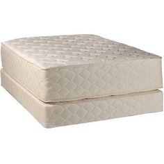 two mattresses sitting side by side on top of each other in front of a white background