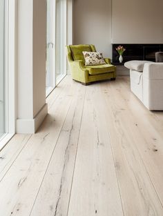 a living room filled with furniture and white walls