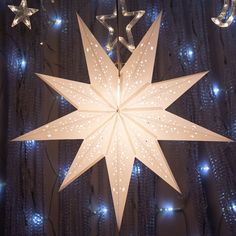 a large white star hanging from the ceiling