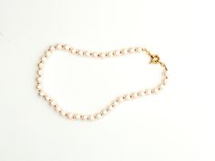 These aren’t your average pearls, not here. Pearls with a pop of color! Introducing our handmade strand of Perolas. Each 8mm Pearl is individually silk knotted with our fun selection of colors! From our poppy coral to our more muted blush and classics like navy. Make your selection for your one of a kind strand of Perolas. 14K GF clasps to compliment each piece. Wear it everyday, all day - in jeans or with the perfect LBD, and perfect for bathing suit attire. All jewelry is made to order and we Handmade Pearl Necklace, Coral Blush, All Day Everyday, Cream Yellow, Unique Colors, Bathing Suit, Freshwater Pearls, Bathing Suits, Poppies