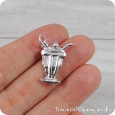 This Milkshake / Ice Cream Sundae Charm comes with a silver jump-ring as pictured. Please note that photo is not to scale and may appear larger to show detail. Refer to exact measurements below.Additional attachments (lobster clasp, large-hole bead, necklace chains) are available from the charm-attachments drop-down menu.  For a visual example of the different attachments and what each one is best suited for, scroll through the photos until you see the example photo or visit https://etsy.me/2BY7 Novelty Silver Pendant Jewelry, Silver Novelty Jewelry With Lobster Clasp, Ice Cream Jewelry, Large Hole Beads, Ice Cream Sundae, Pandora Bracelet, Beaded Dangles, Bead Charms, Chains Necklace