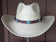 This hitched webbing hatband has a black leather base that is 15mm wide. Copper patina southwest style Conchos accent the band. Ties on with the deertan lace, slide the deer antler bead bead up to "tighten and tie 2 knots in the lace to secure the band. 23" long. Looks great on both palm and felt hats. Hat not included. Adjustable Concho Hat For Festivals, Bohemian Adjustable Concho Hat Bands, Bohemian Concho Hat Bands Adjustable, Adjustable Bohemian Concho Hat Bands, Southwestern Adjustable Concho Hat, Adjustable Southwestern Concho Hat, Custom Adjustable Hat Bands For Festivals, Traditional Adjustable Hat For Outdoor, Adjustable Southwestern Hat Band For Western-themed Events