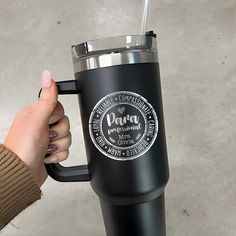 a person holding a black coffee cup with a straw in it's mouth and the words pura prosciuta written on it