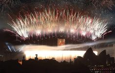 fireworks light up the night sky over sydney harbour during new year's eve celebrations