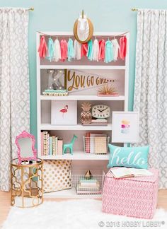 an image of a room that is decorated with pink, blue and white decor on the walls