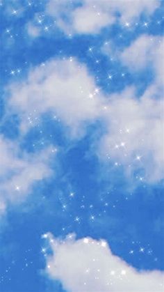 an airplane flying in the sky with many stars on it's back end and some clouds below