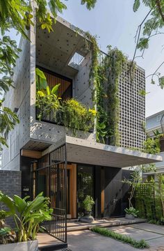 an apartment building with plants growing on the side