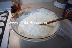 a glass bowl filled with white food on top of a counter