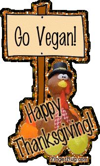 a sign that says go vegan happy thanksgiving with a turkey in front of it