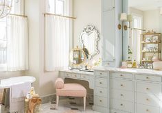 a bath room with a tub a sink and a mirror on the wall next to a window