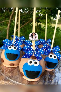 some cupcakes with blue and white decorations on them