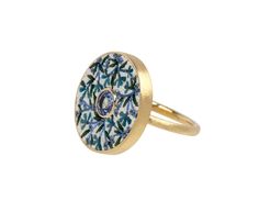 Inspired by the tradition from Ancient Rome, this Le Sibille ring has the perfect combination of modern vibe and traditional design. The blue and white floral micromosaic has been hand-crafted and set around the shimmering blue sapphire. It is set in a closed back setting of 18K yellow gold and sits at the center of the matte 18K yellow gold band. ring face : 3/4" diameterblue sapphire : 5mm diameter : .56cttw18K yellow gold band width : 2mmsize available : 6.75please contact us for sizing optio Daniela Villegas, Alice Cicolini, Digby And Iona, Rebecca Overmann, Zoe Chicco, Cathy Waterman, Blue And White Floral, Gold Band Ring, Single Stone