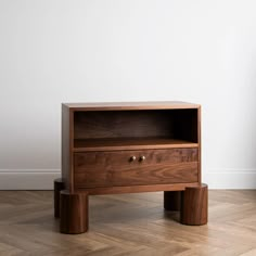 a wooden table with two drawers on it