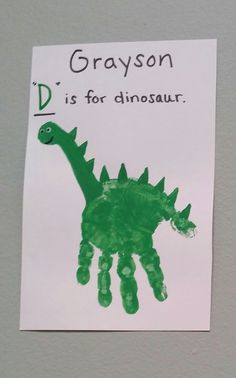 a dinosaur handprint on a piece of paper with the words d is for dinosaur