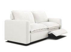 a white couch with two pillows on it