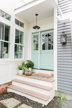 the front porch is clean and ready to be used as a place for potted plants