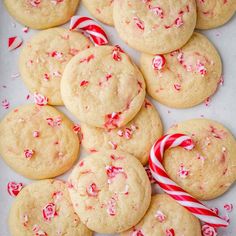 peppermint cookies and candy canes on a baking sheet ready to be eaten