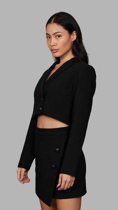 The 'Blvck Cropped Blazer' features a cropped design with a lapel neckline, as well as two engraved snake buttons. The model wears a size XS and is 173cm. True to size fit. Fabric: 70% polyester 26% cotton 4% spandex Blvck Paris, Mini Wrap Skirt, Blazer And Skirt Set, Mini Wrap, Blazer And Skirt, Bleach Wash, Cropped Blazer, Traditional Fashion, All Black Outfit