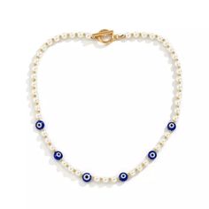 DESCRIPTION Our Evil eye pearl chain Necklace is perfect for those looking to add a bit of color to your everyday look! This would look great worn with the matching Blue Necklace or even just layered up with other necklaces as an additional accessory. We think you will love this piece as much as we do. FEATURES Synthetic pearls Gold-tone finish chain Toggle Clasp Unisex style Pearl Necklace Designs, Pearl Chain Necklace, Mens Jewelry Necklace, Beaded Choker Necklace, Evil Eye Necklace, Pearl Pendant Necklace, Men Vintage, Blue Necklace, Color Dorado