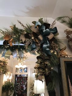 a christmas wreath is hanging from the ceiling