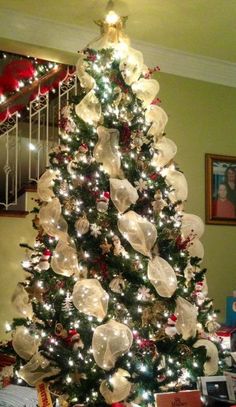 a decorated christmas tree in a living room