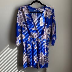 New Tahiti’s Sunrise Romper In Royal Blue Size Medium New W/ Tags Yumi Kim B:E Blue Printed Jumpsuit For Spring, Blue Printed V-neck Jumpsuits And Rompers, Blue Floral Print Jumpsuits And Rompers For Day Out, Blue Long Sleeve Jumpsuits And Rompers For Vacation, Blue Long Sleeve Jumpsuit For Vacation, Chic Blue Floral Print Jumpsuits And Rompers, Kim Pants, Metallic Jumpsuits, Burgundy Jumpsuit