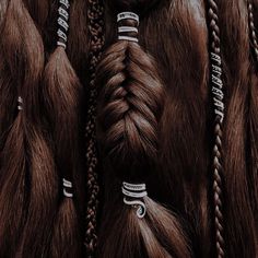 several braids with rings on them are shown