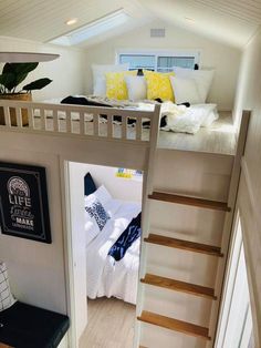 a loft bed with stairs leading to the bedroom