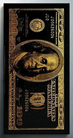 a black and gold one dollar bill on a wall