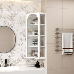 a bathroom with a sink, mirror and towel rack on the wall next to it